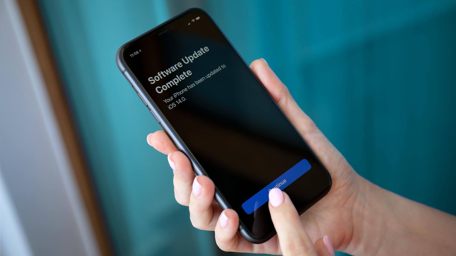 Black iPhone showing a successful update was completed.