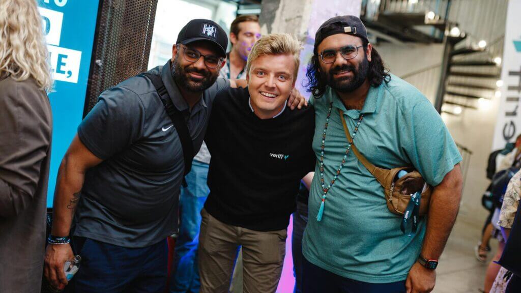 Three men taking a photo
