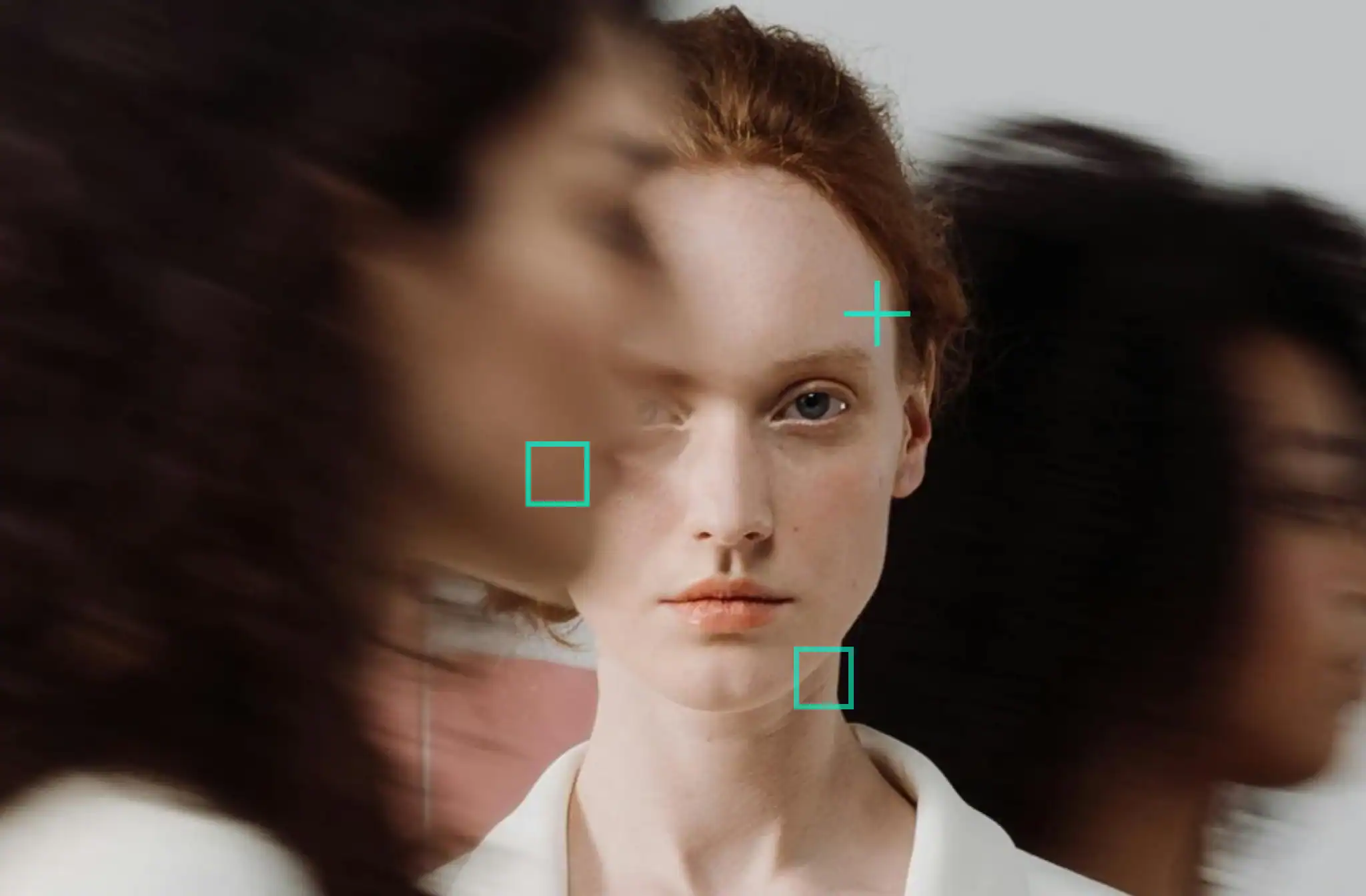 a woman with red hair and a white shirt