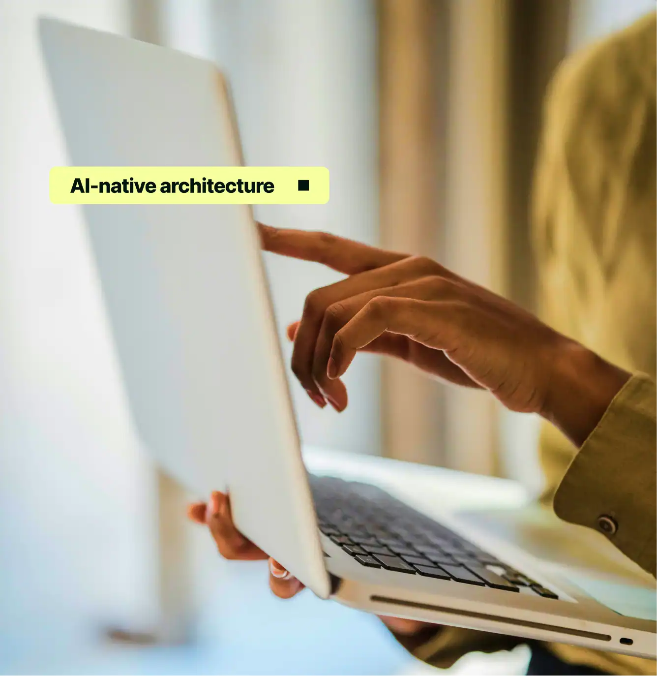 Person using laptop with text overlay