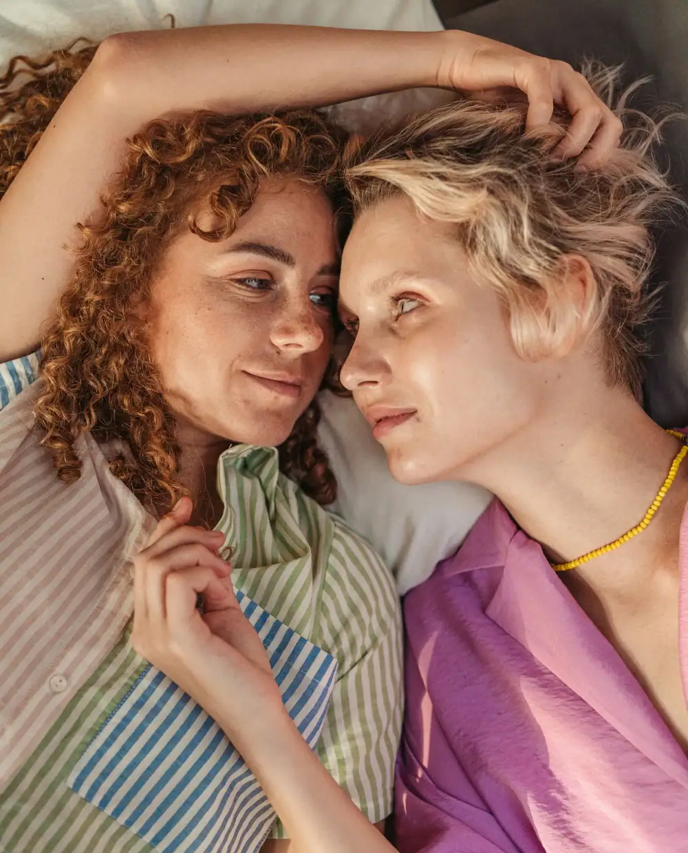Two women smiling at each other